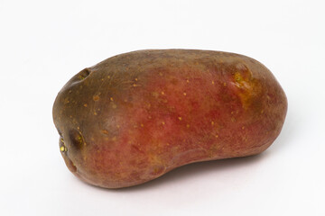 Single potato isolated over a white background