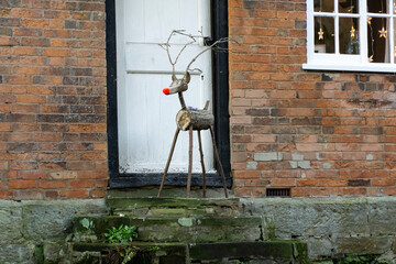 Wooden Christmas reindeer on a door step