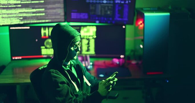 Young nerdy hacker mobile security. Smart phone hacking on dark web fraud cyber passwords code malware hacking servers attack firewall phishing credit cards. Surveillance privacy GDPR concept security