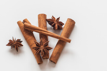 Cinnamon sticks and star anise on a white background