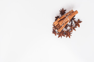 Cinnamon sticks and star anise on a white background
