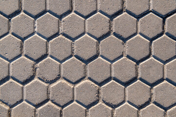 Background of stone tiles in the form of honeycombs.