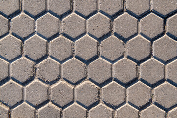Background of stone tiles in the form of honeycombs.