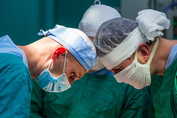 Team of surgeons performing surgery in hospital