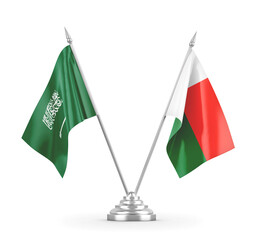 Madagascar and Saudi Arabia table flags isolated on white 3D rendering