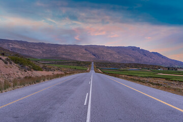 N1 highway through Hex River valley wine farms and mountains with cloud sky in Western Cape South Africa
