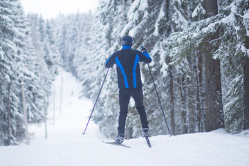 Fototapeta na wymiar Skier on the ski track. Cross country ski.