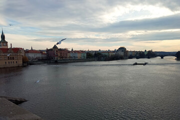Fototapeta na wymiar Cloudy winter day in Prague by the river.