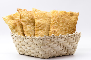 Brazilian pastry, traditional pasta called meat pastry on isolated on white background, copyspace
