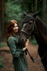 Gourmet lady in a vintage dress. A beautiful rider gently hugs the horse. Artistic Photography