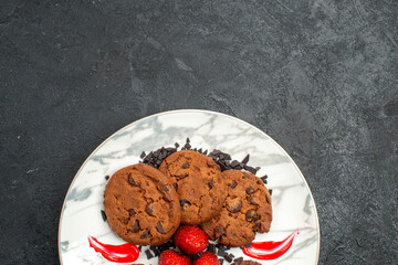 top view delicious choco biscuits for tea inside plate on dark floor sweet cookie cake