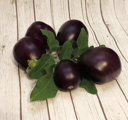 Ripe eggplant on a striped background