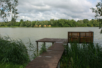 wooden pier on the lake - 400620526