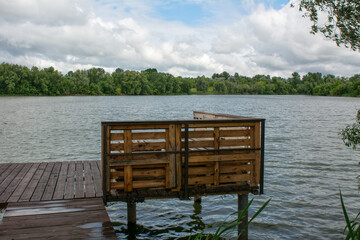 wooden pier on the lake - 400620571