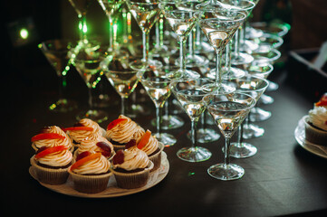 festive buffet table with snacks and glasses of champagne
