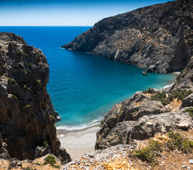 Cliff and sea against sky