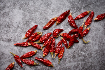 Red chilli peppers on stone background. Top view.
