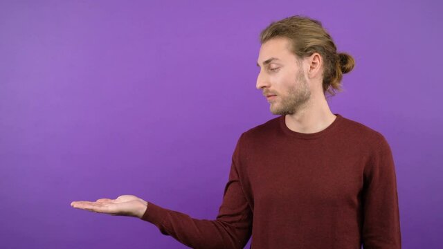 half-length portrait of a calm man showing an open hand in an empty space. 4K