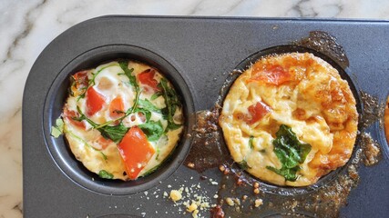 Eggs and quinoa muffin are a perfect homemade breakfast with spinach, tomatoe and parmesan cheese
