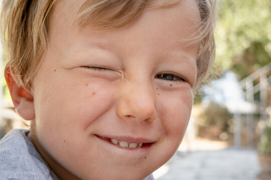 Boy Winking With Eyes