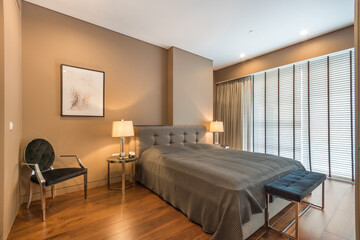 Bright  bedroom with king-size  bed with bedside tables and lamps