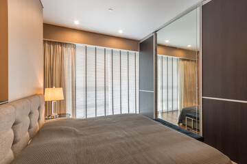 Small  bedroom with king-size  bed with bedside tables and lamps