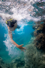 Young boy snorkeling underwater