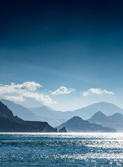 Blue sea with mountains