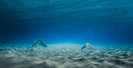 Stones surrounded with rippled sand
