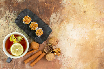 top view cup of tea with cinnamon and confitures on light desk candy photo tea