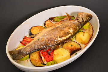 River trout with grilled potatoes and vegetables. Can be used for restaurant menu.