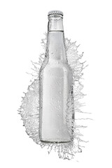 Transparent glass bottle with water splash isolated on white.