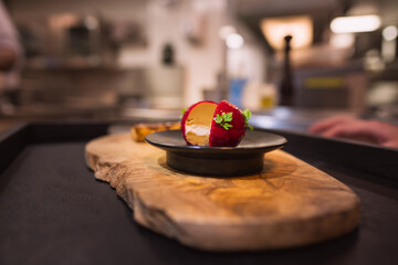 Red Foie Gras served on  wooden slab background, with black tray. Xmas, celebration, luxury expensive food
