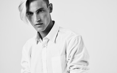 Handsome young man in light shirt cropped hairstyle model
