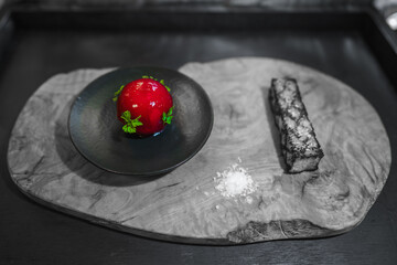 Red Foie Gras served on  wooden slab background, with black tray. Xmas, celebration, luxury expensive food