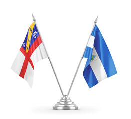 Nicaragua and Herm table flags isolated on white 3D rendering