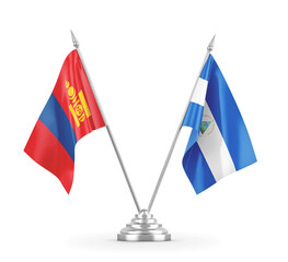 Nicaragua and Mongolia table flags isolated on white 3D rendering