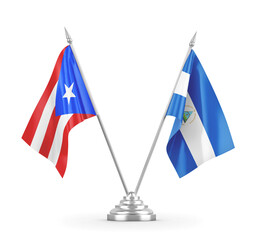 Nicaragua and Puerto Rico table flags isolated on white 3D rendering