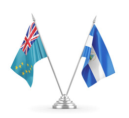 Nicaragua and Tuvalu table flags isolated on white 3D rendering