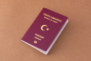 Turkish citizen public passport on th craft background.