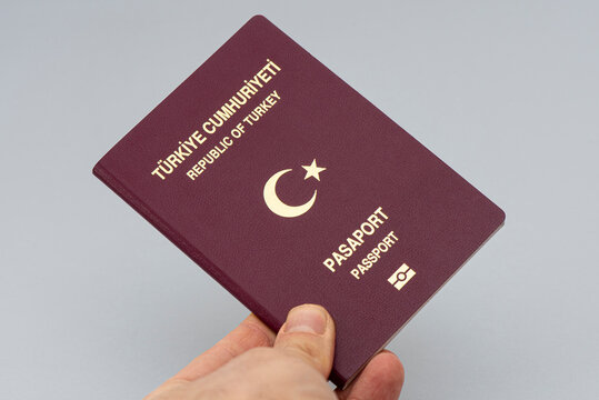Turkish citizen public passport on th gray background.