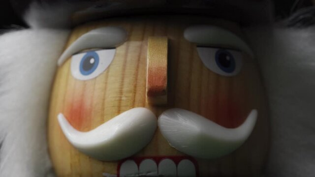 Macro Shot Of Wooden Christmas Nutcracker, Face Of A Festive Toy Soldier Ornament