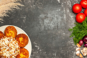 top view tasty fried cutlets with cooked rice on a grey background dish photo meat