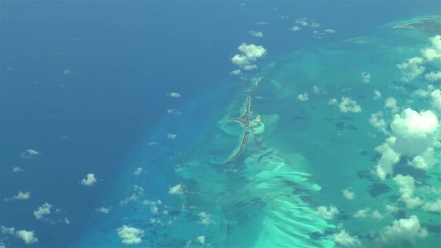 Flying over The Bahamas. Beautiful ocean colors. Actual aerial footage.