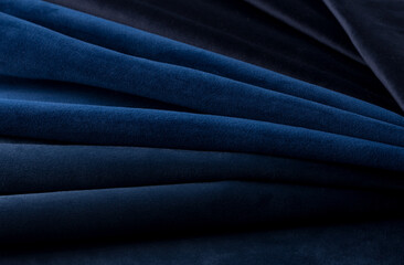 Deep blue velour textile sample. Fabric texture background