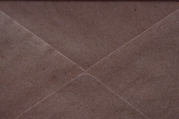 Fototapeta premium opened envelope which is made from recycled paper - close up, textured paper background, message and letter