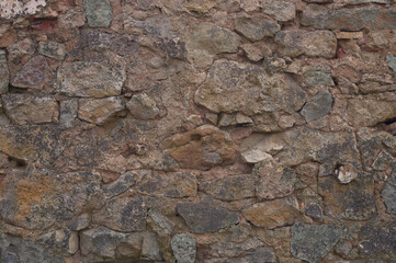 background of stone. in the photo, the stone wall of the old building