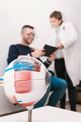 Graduation of a boy's eyesight by an optometrist