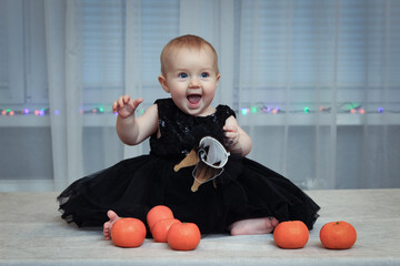 Smiling baby girl  with tangerines 