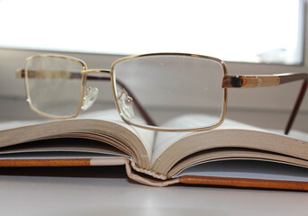 Glasses on an open book